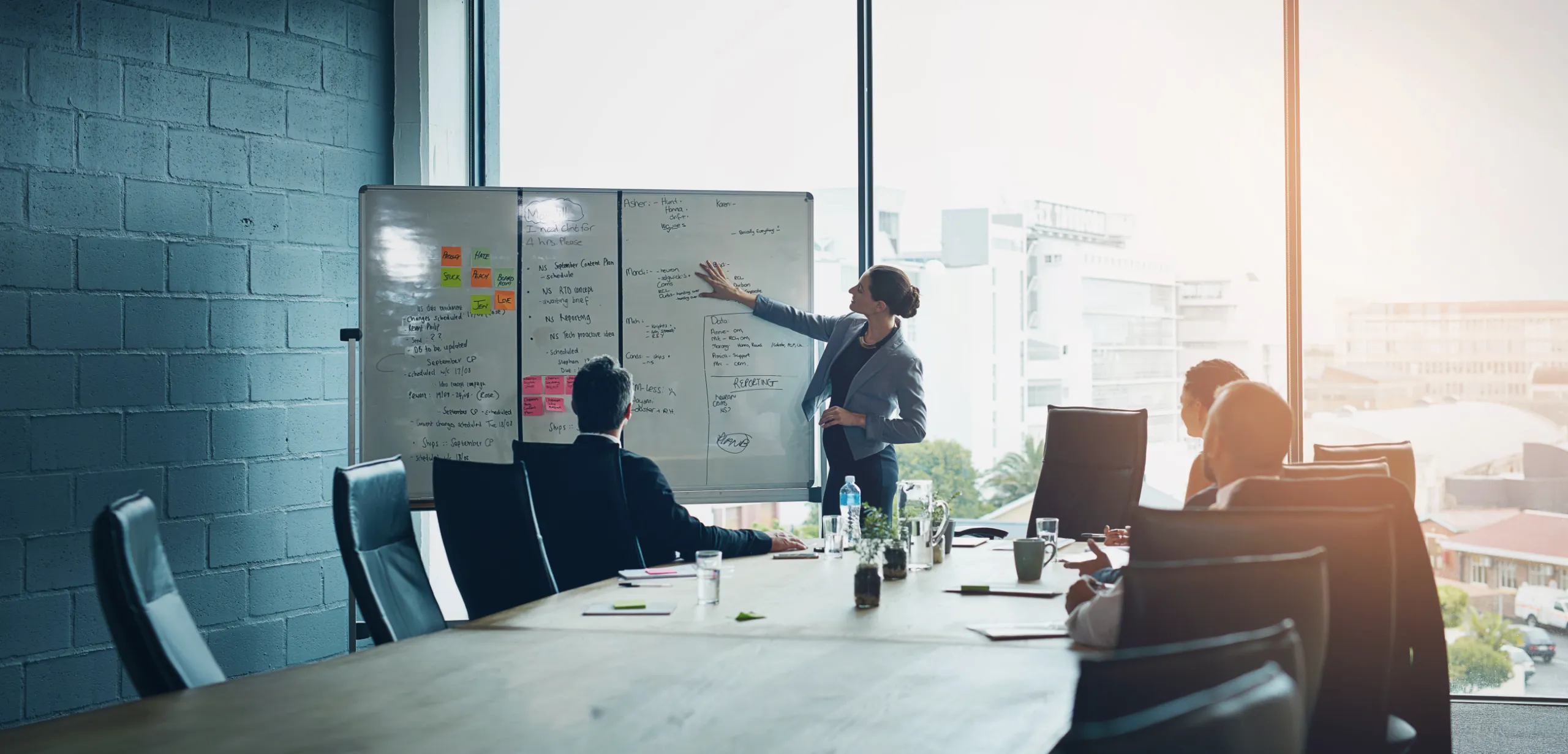 business-meeting-whiteboard-woman-speaker-with-presentation-office-planning-schedule-project-management-leadership-coaching-manager-hand-pointing-objectives-note-priority