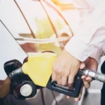 man-putting-gasoline-fuel-into-his-car-pump-gas-station