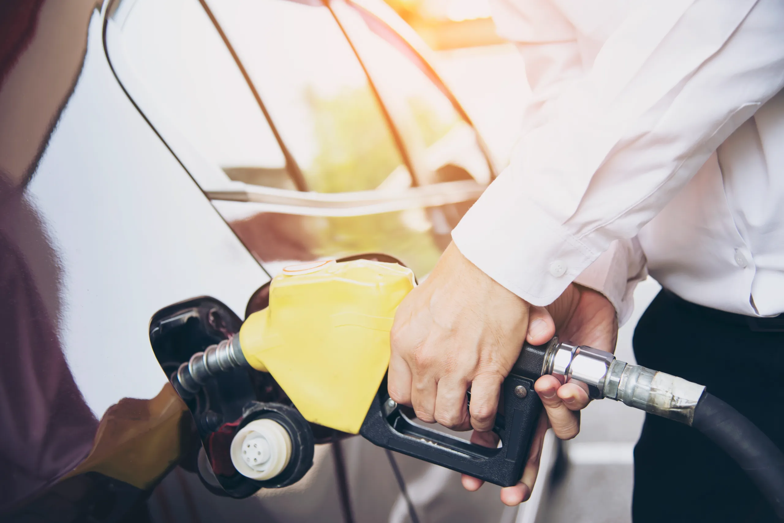 man-putting-gasoline-fuel-into-his-car-pump-gas-station